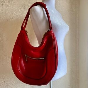 J. Crew red leather hobo handbag with brass hardware and dust bag.